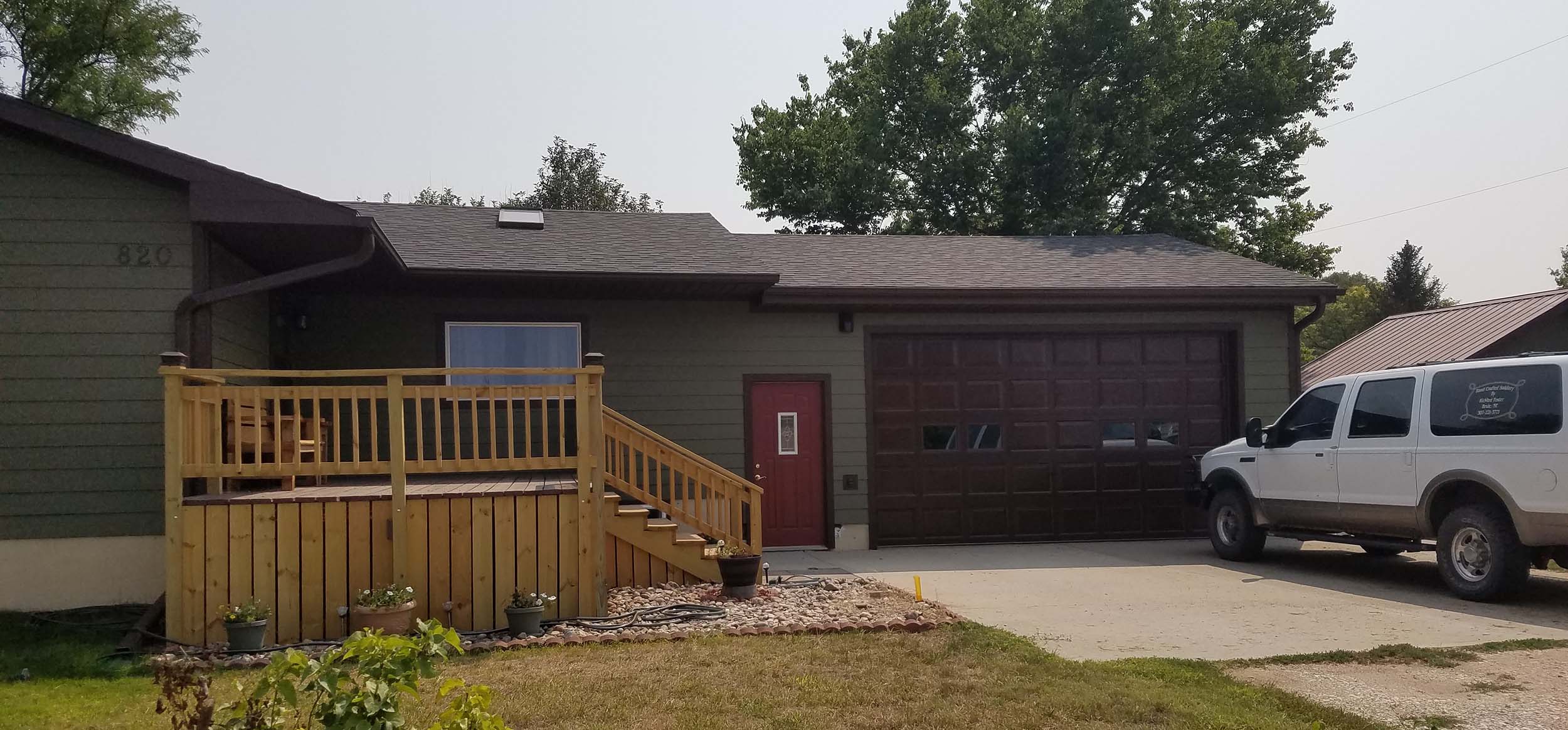 Ring the doorbell on the deck, to the left of the red door.